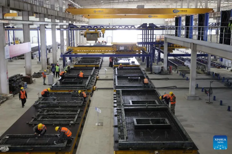 Precast concrete manufacturing floor with crew