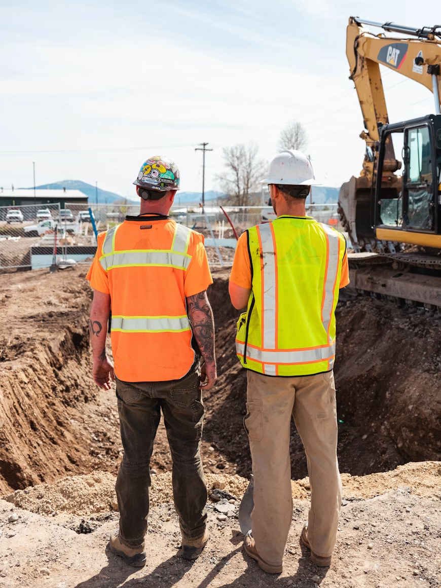 Labour hire crew assessing a site excavation